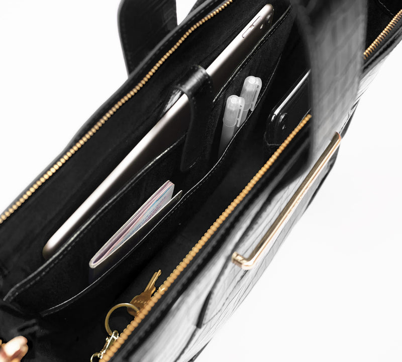 Interior of a black embossed croc leather crossbody handbag